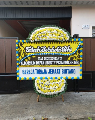 Papan Bunga Duka di Dolo